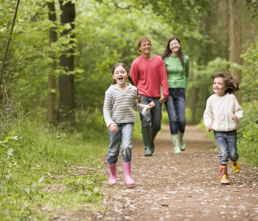 Family of 4 walking through forest in Loch Lomond