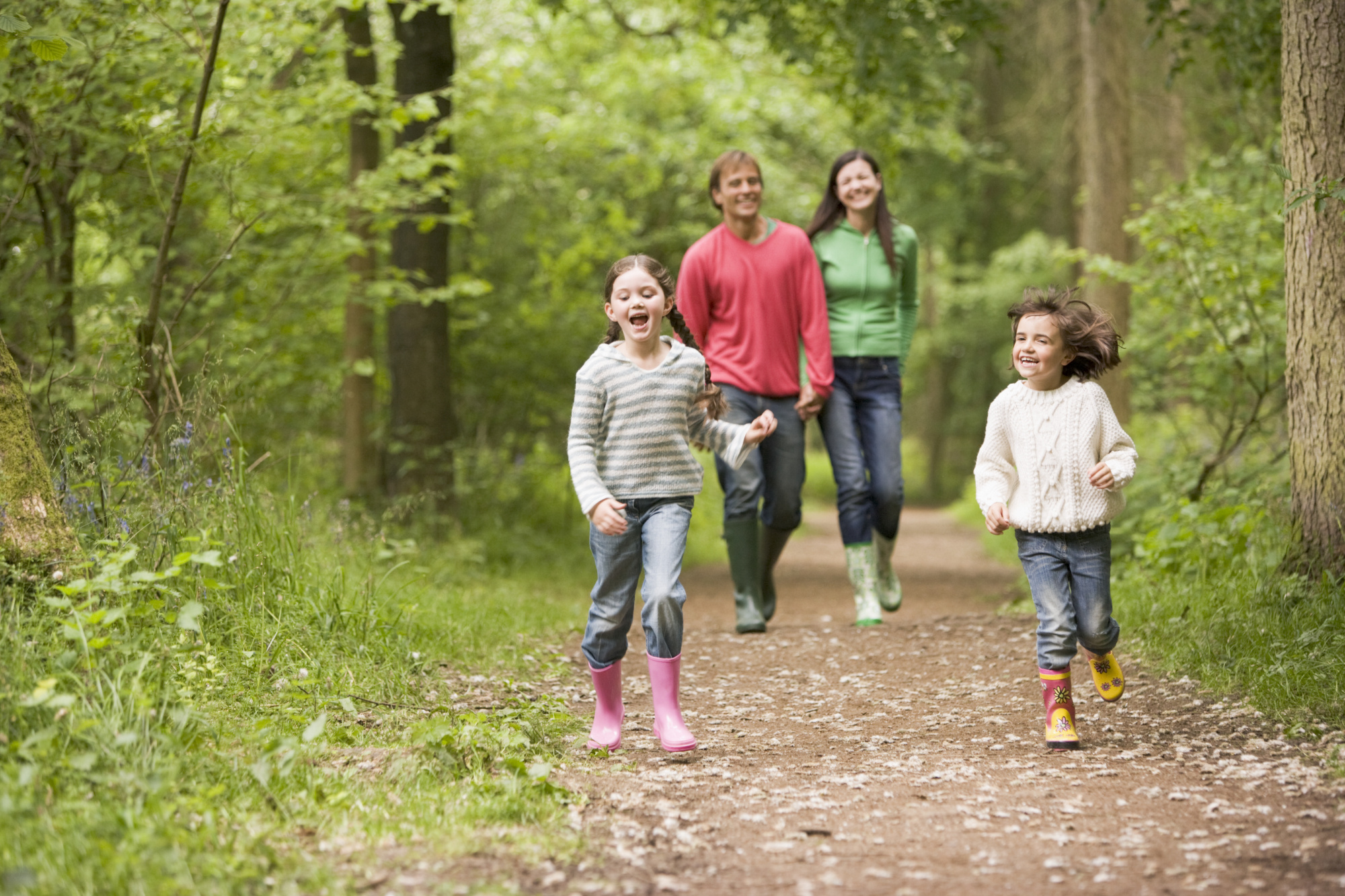 Family of 4 walking through forest in Loch Lomond