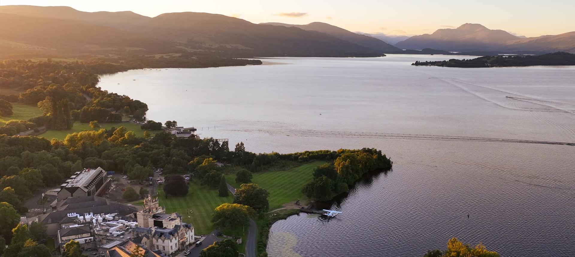 a bids eye view over looking cameron house and the large body of water surrounding it