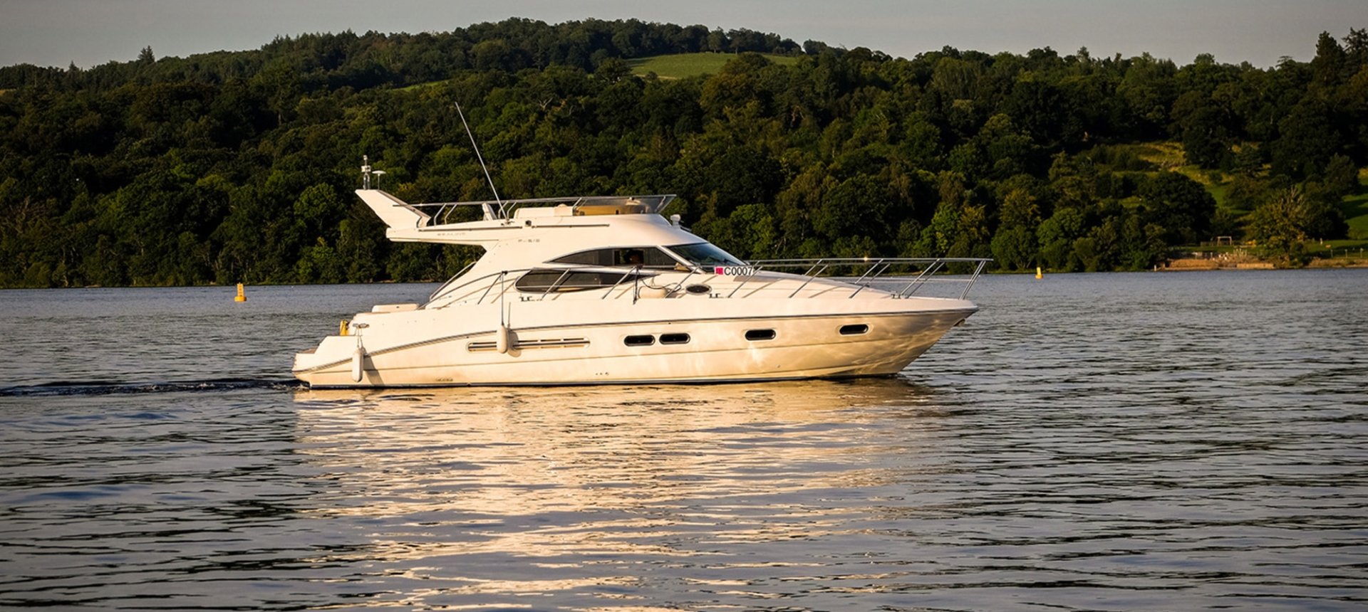 A pleasure boat on the waters of Loch Lomond, near Cameron House Hotel Scotland