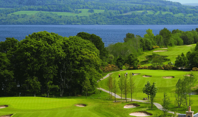 a over head view of a golf course with people playing golf below