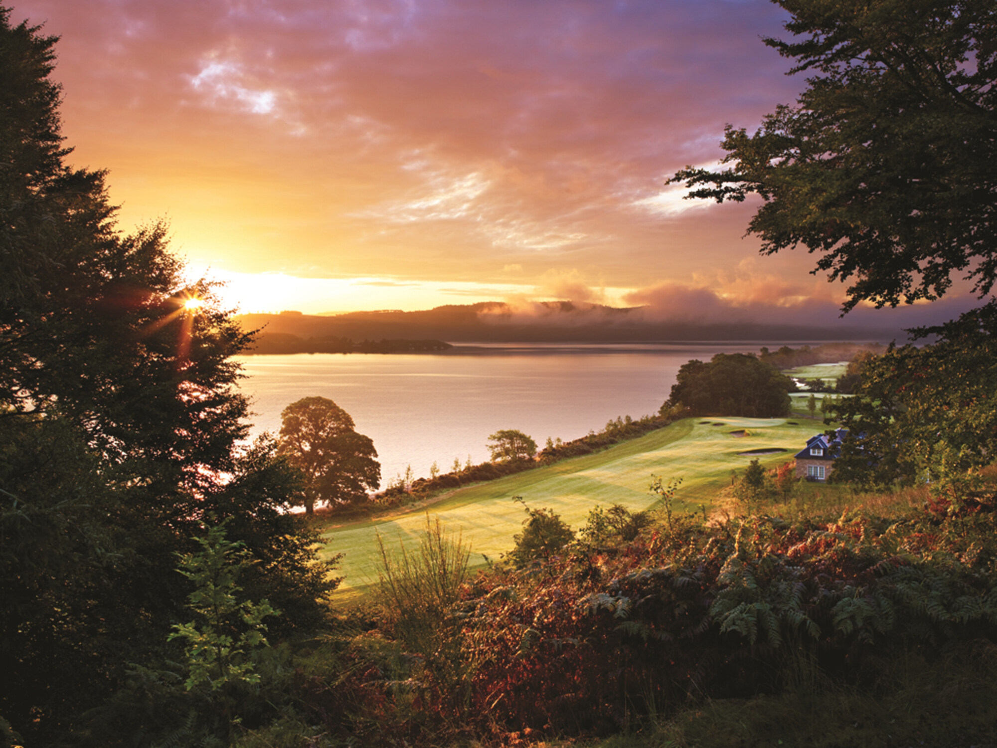 a view of the sunset and lake