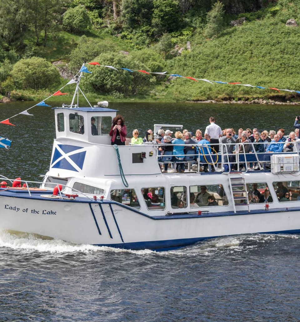 a group of people on a tour boat in the middle of the water