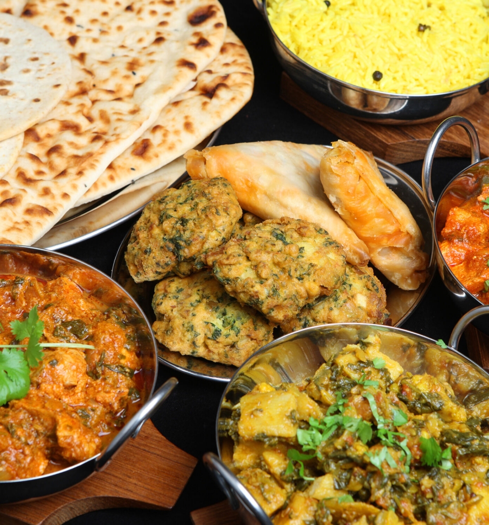 bowls of freshly made masala and naan bread