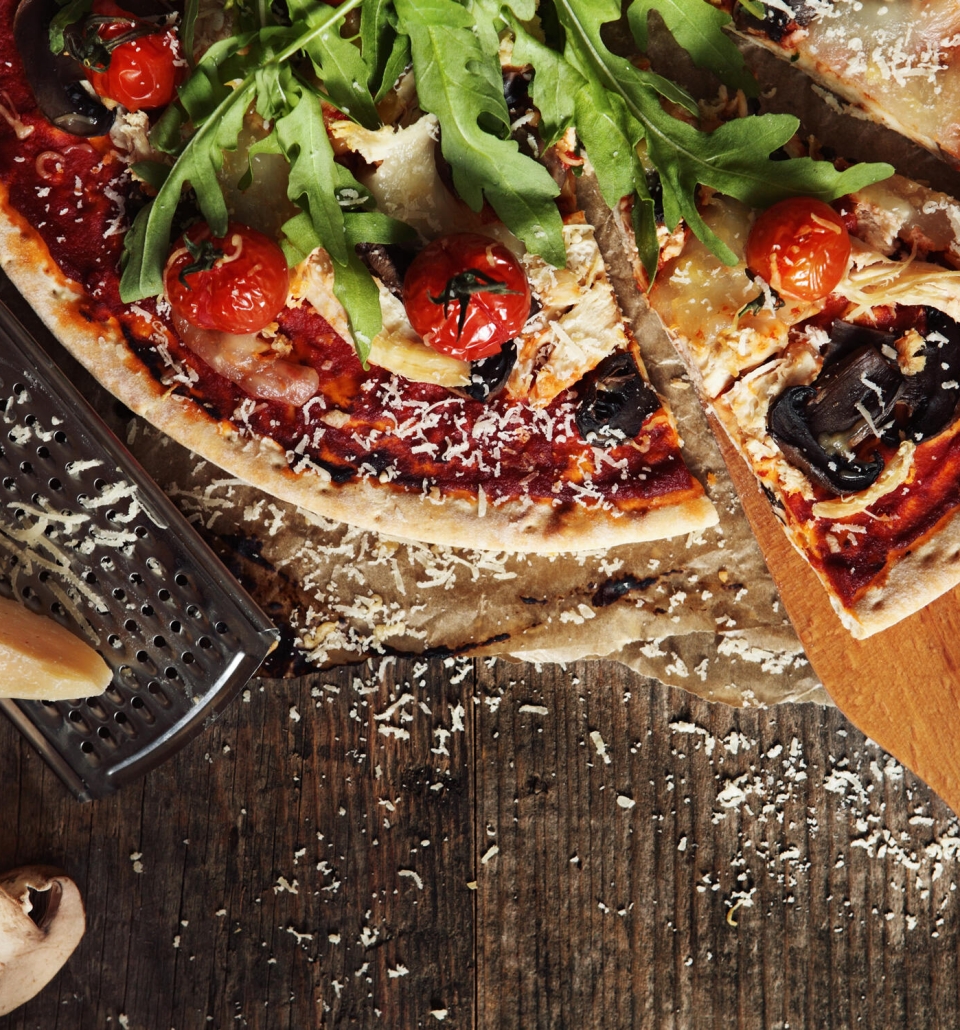 a slice of pizza being removed with a spatula