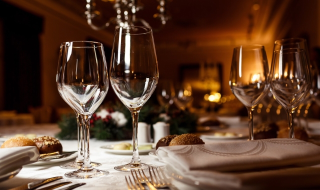 close up view of wine glasses on a table set up for dinner