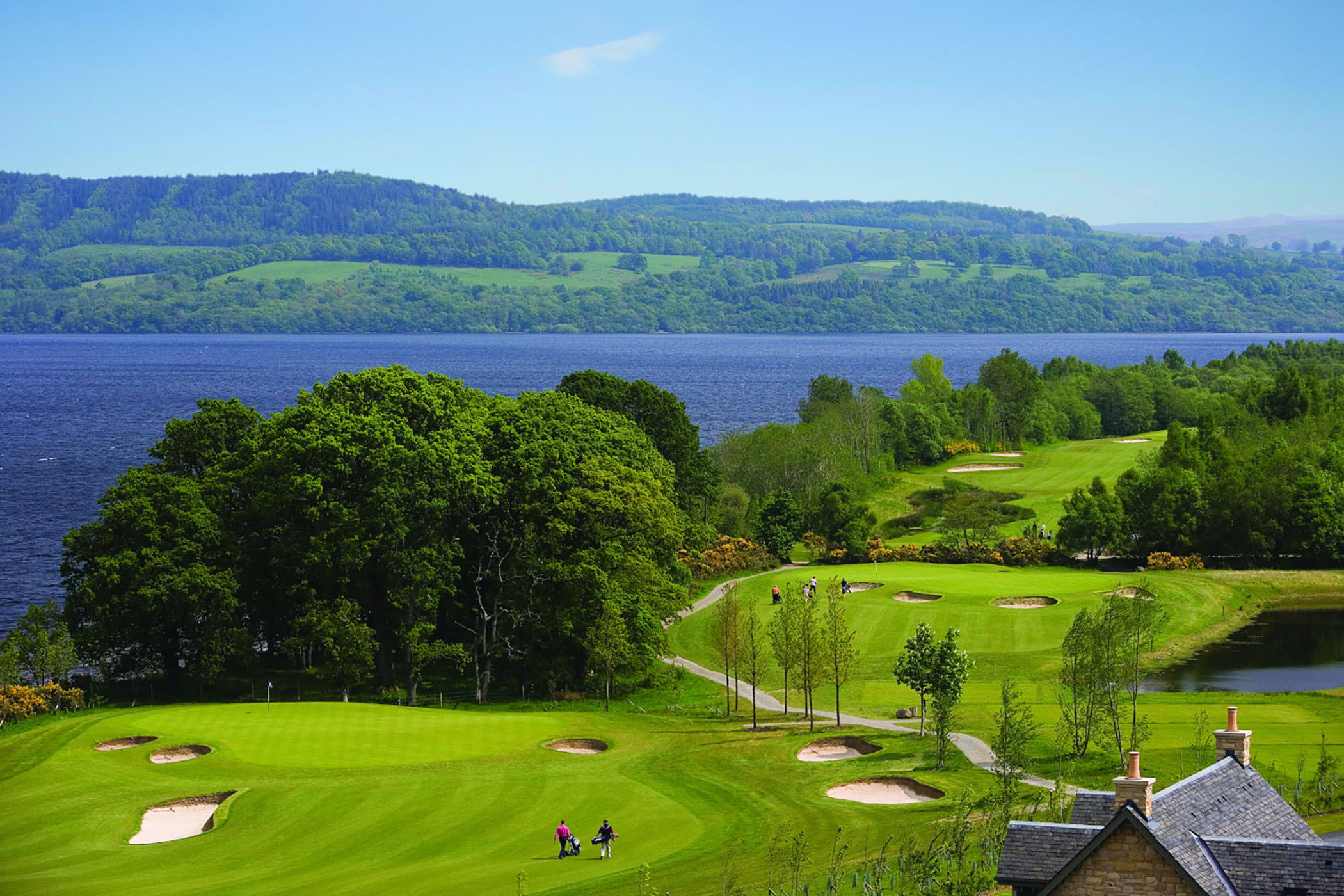 birds eye view of golfers walking across the golf course