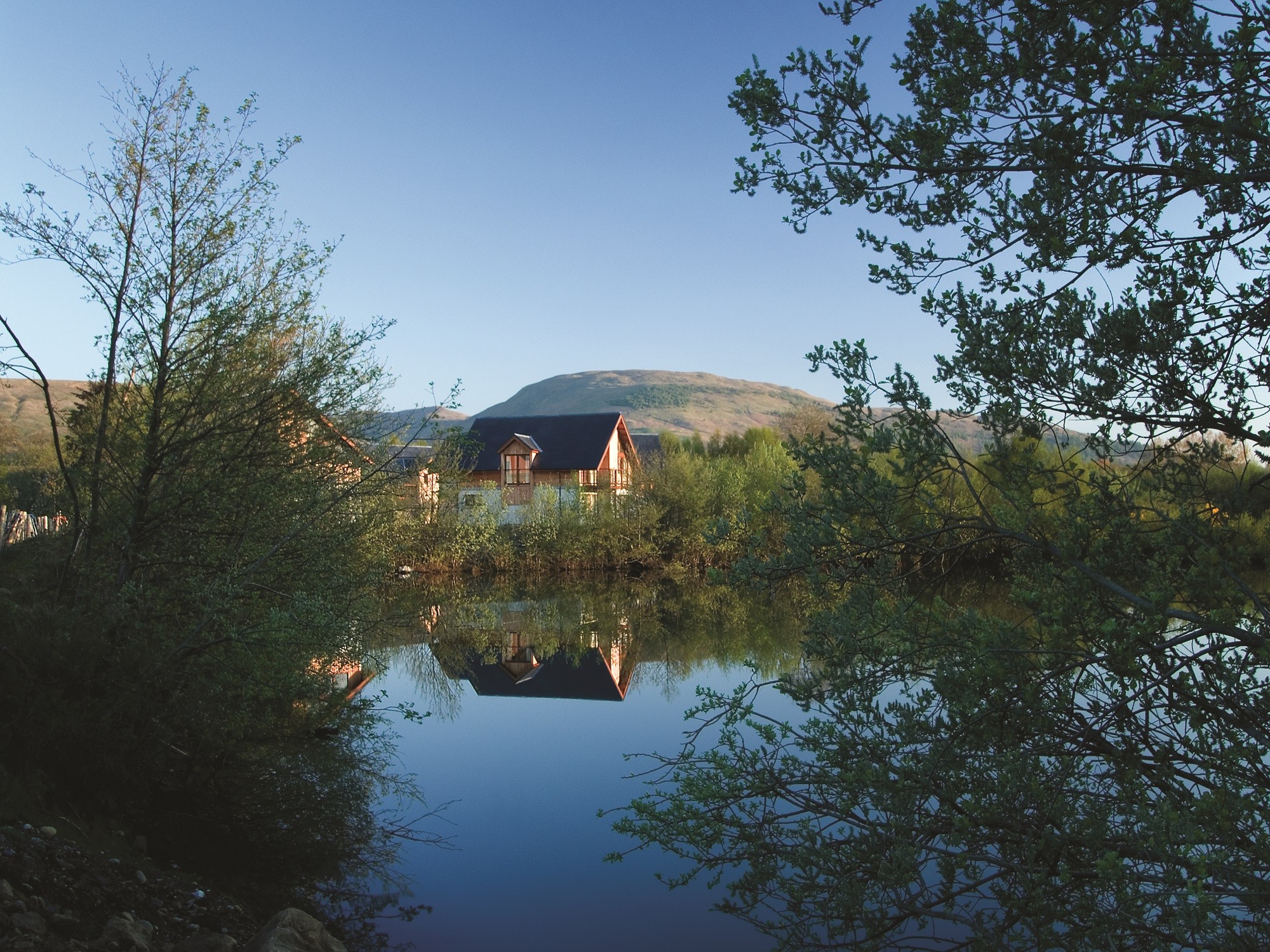 The Carrick Lodges as seen from across the water