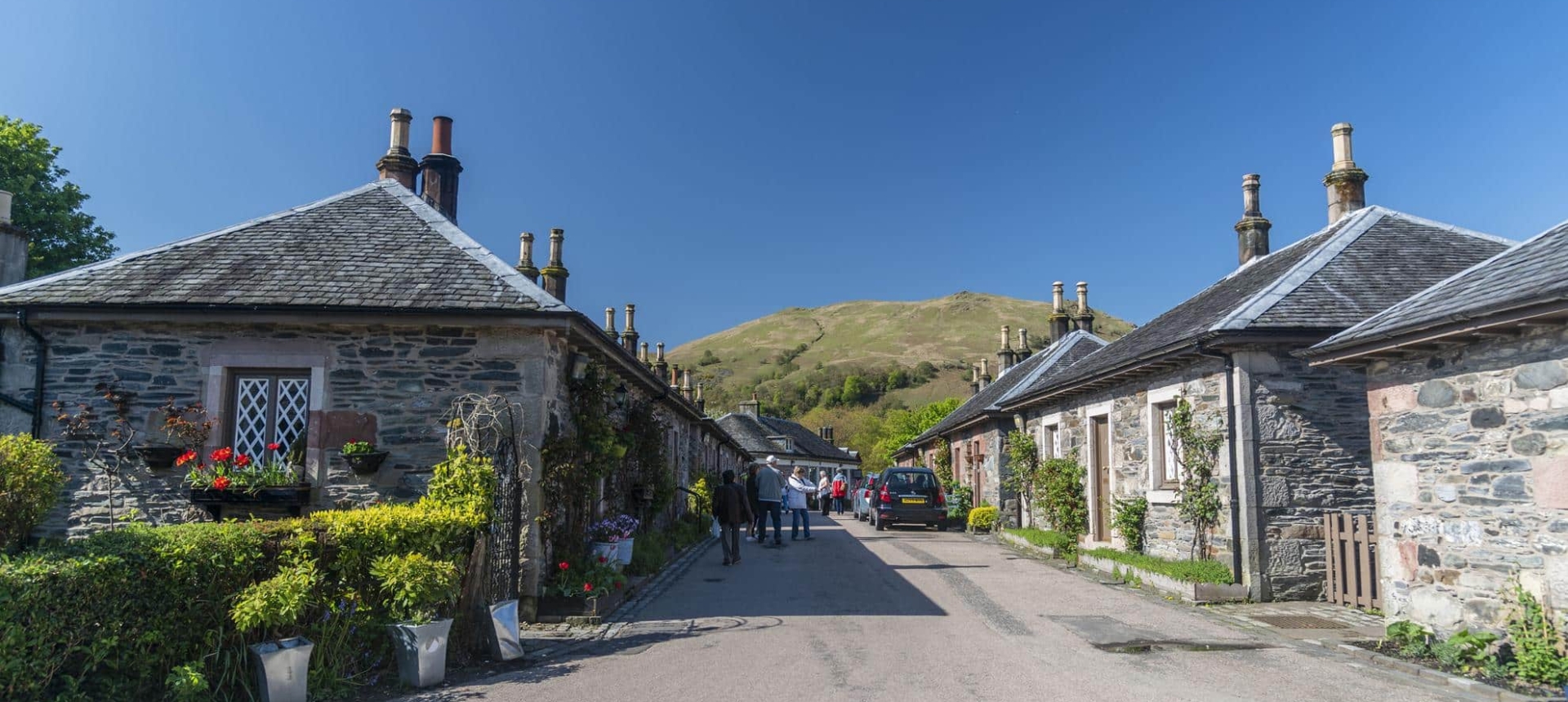 A street in Luss during a sunny day.